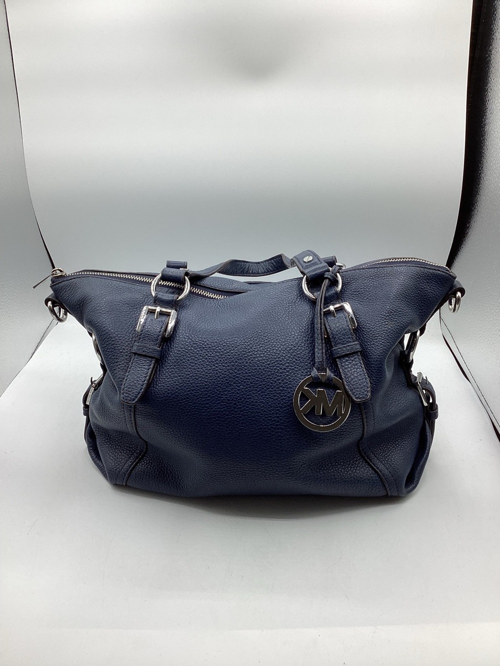 Michael Kors Navy Leather Satchel with Silver MK charm.
